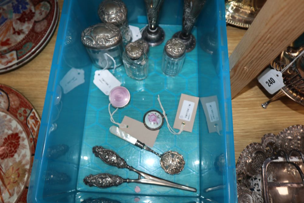 A pair of embossed silver specimen vases, five silver-mounted toilet bottles, two silver and enamel boxes and a quantity of plated item